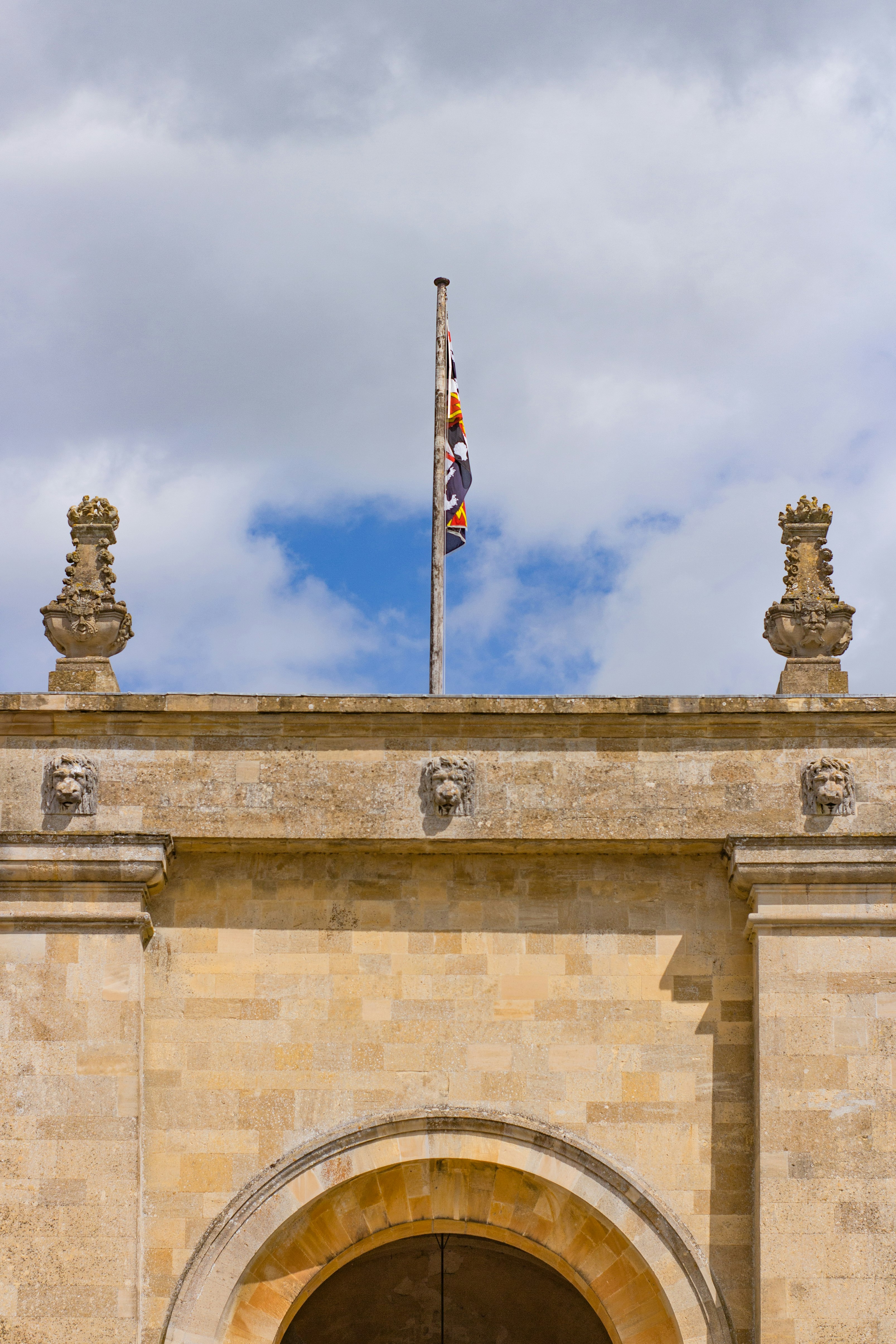 brown concrete building with flag of us a during daytime